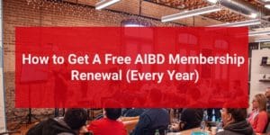 Photograph of a conference with a text overlay that says "How to Get a Free AIBD Membership Renewal (Every Year)"
