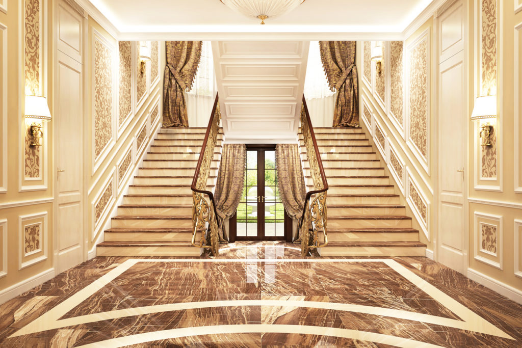 Entrance to a beautiful big Luxury house including double return stair with panels.